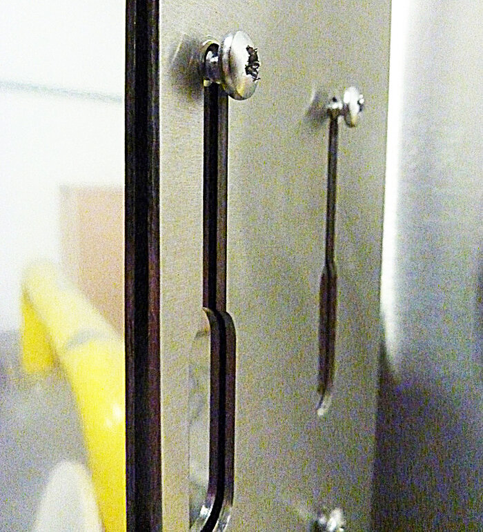 slots resting on screws